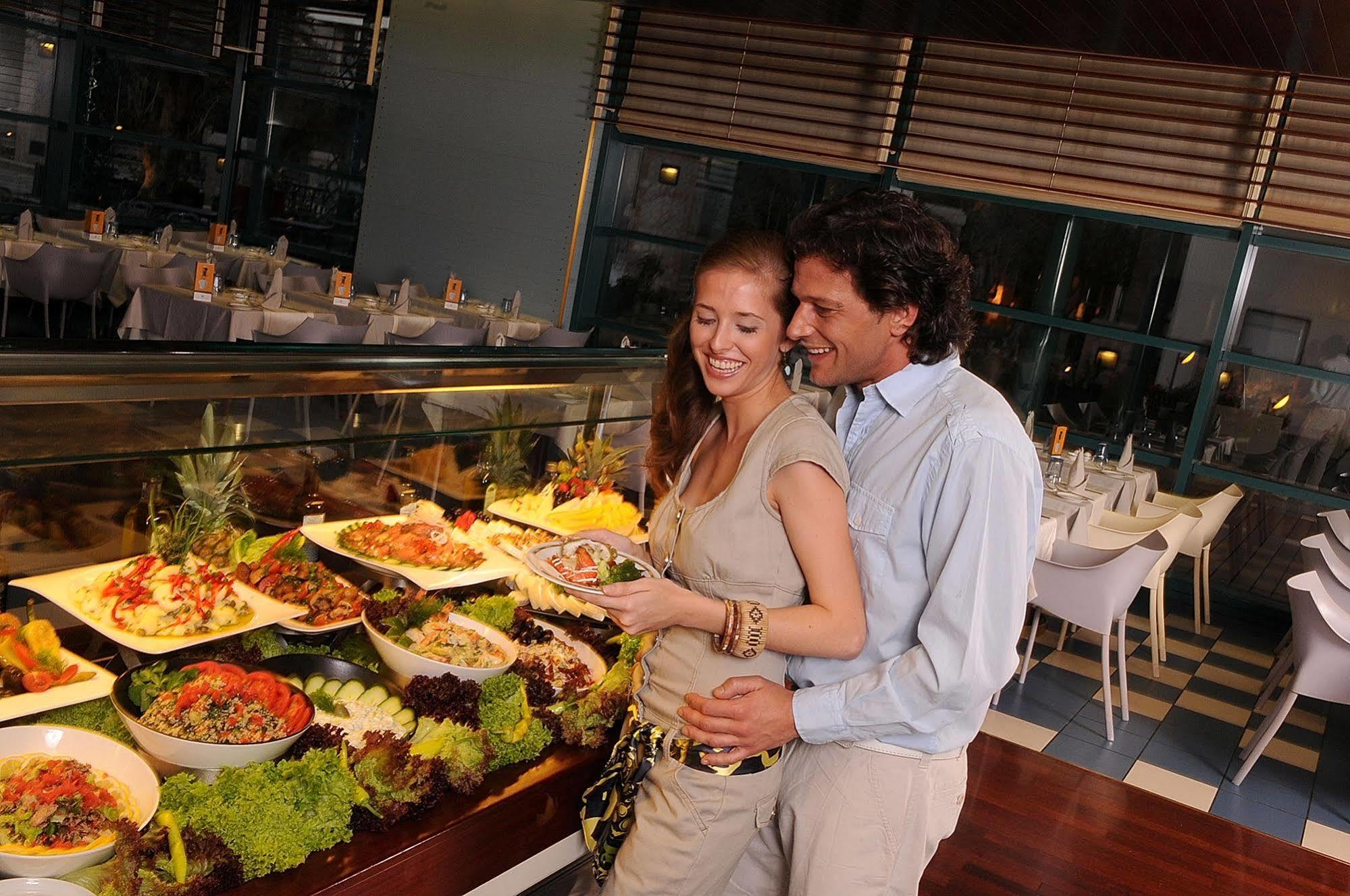 Club Hotel Casino Loutraki Exterior photo A couple at a buffet